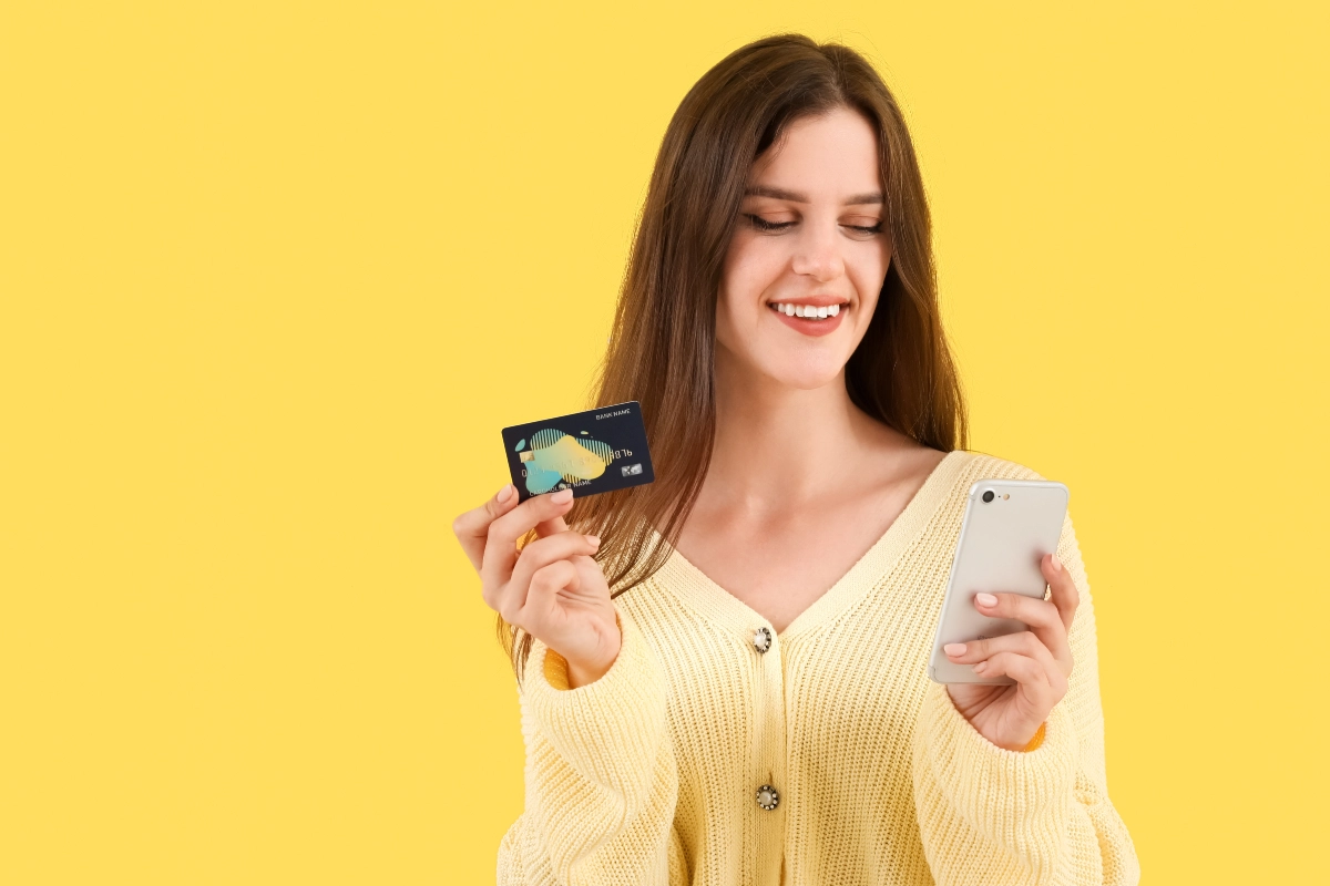 Woman With A Phone And Credit Card 1200X800